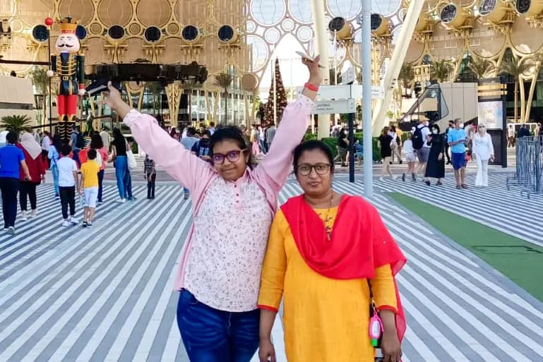 Reena smiling warmly, showing her joyful and caring personality