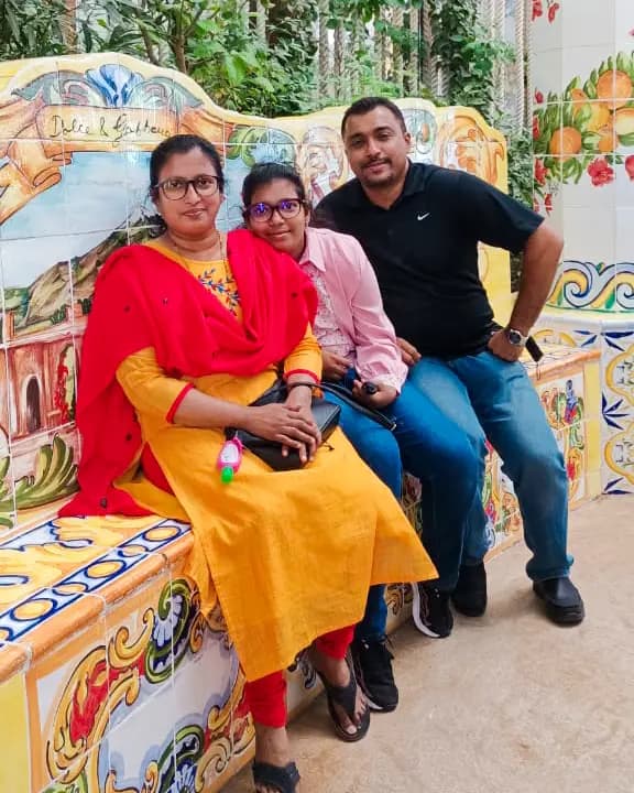 Reena surrounded by family, displaying the love and joy she brought to those closest to her